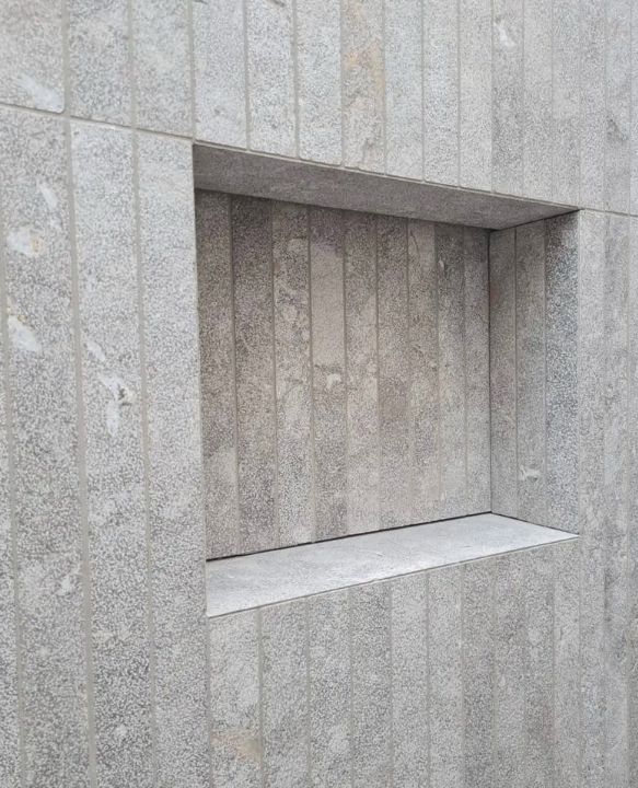 Nordline atelier, light through a stone atrium